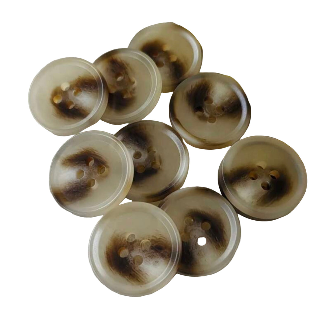 Set of round buttons with brown spots on a cream background